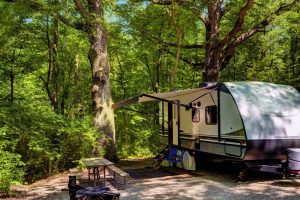 RV camping at campground with picnic table